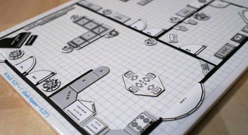 Magnetic furniture templates on a scaled planning board