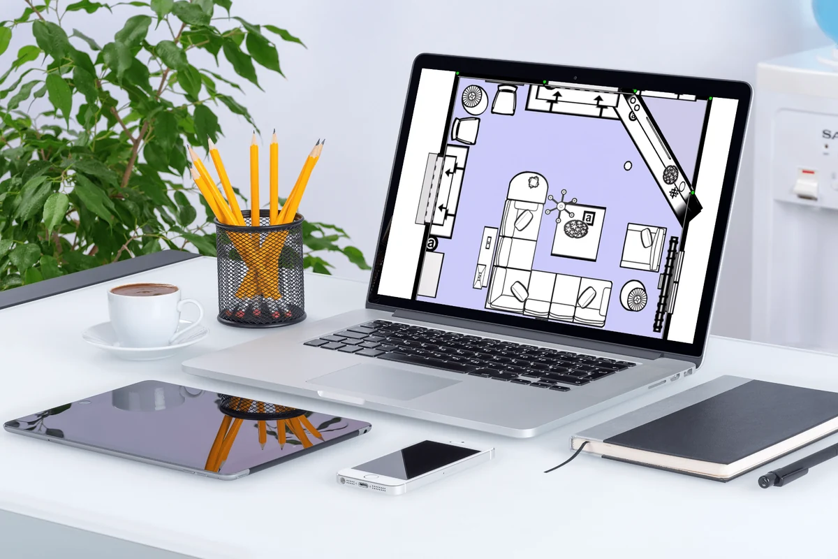 3Dream room planning on a MacBook at a designer’s desk